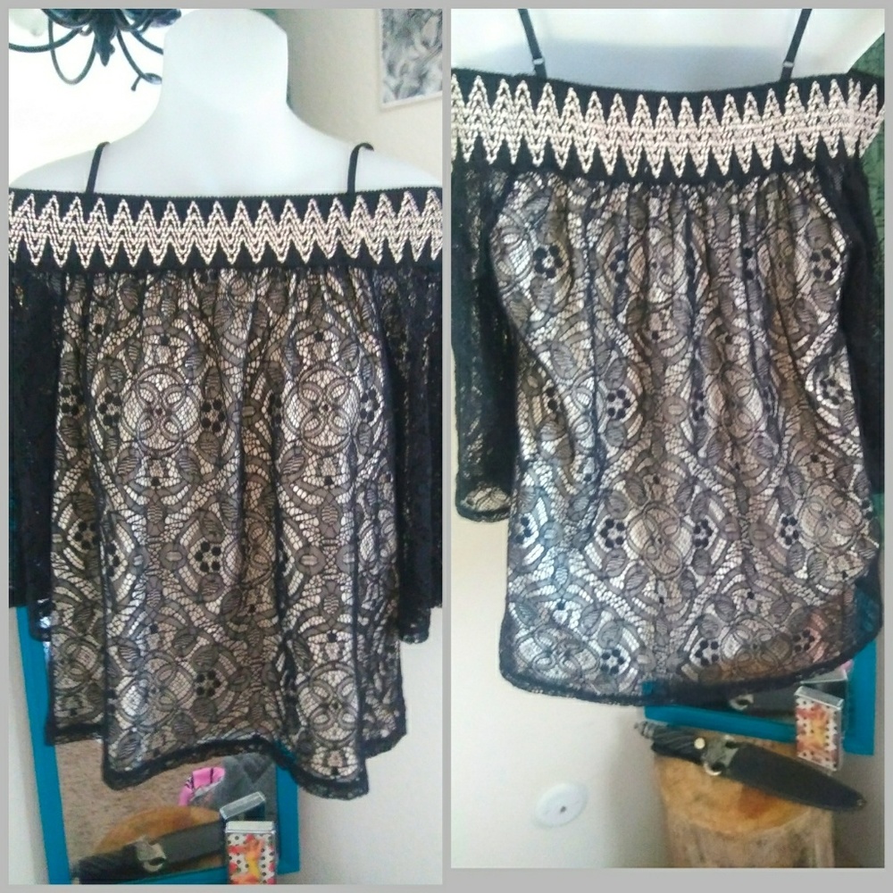 Lacy blouse with nude base, off the shoulder.